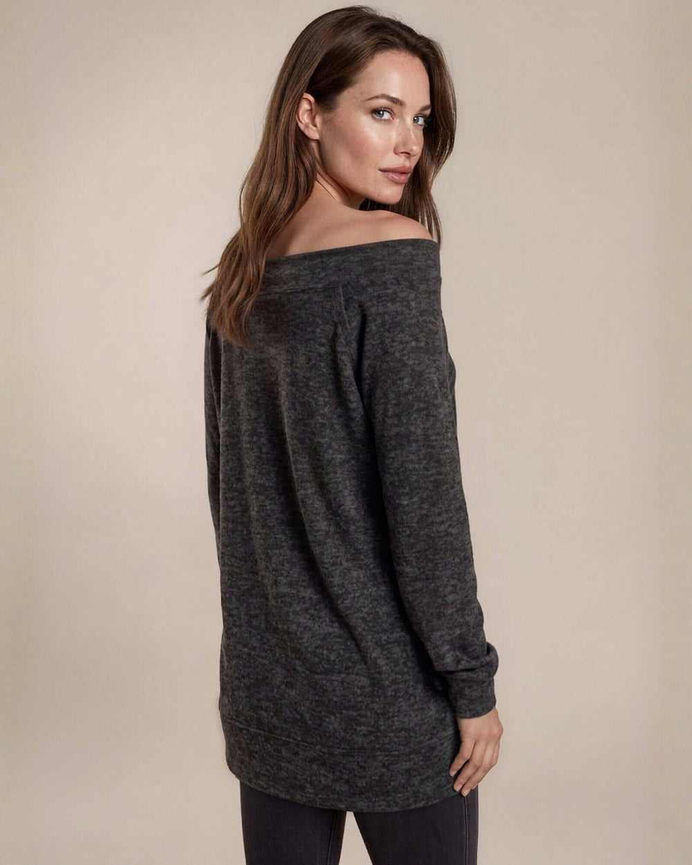 Made in USA women's charcoal black heather off-the-shoulder long sleeve knit top with raw edge seams and banded cuffs, back view
