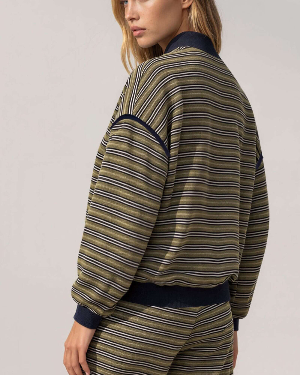 Made in USA women's olive and navy striped relaxed fit crewneck long sleeve top with ribbed trim, back close-up view
