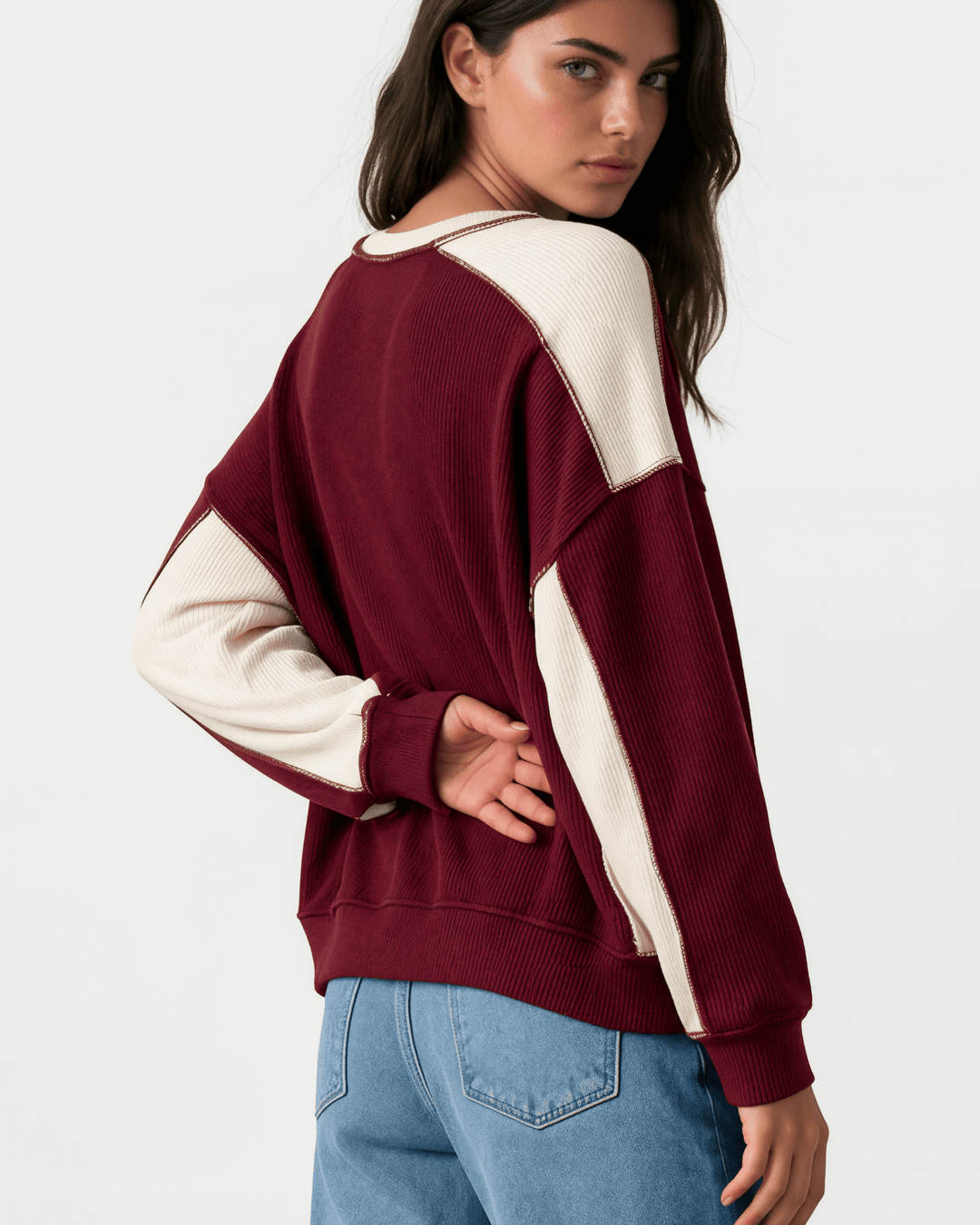 Made in USA. Burgundy &amp; cream color block ribbed knit sweatshirt. Notched neck, exposed seams, oversized fit. 97% polyester. Sizes S–XL.