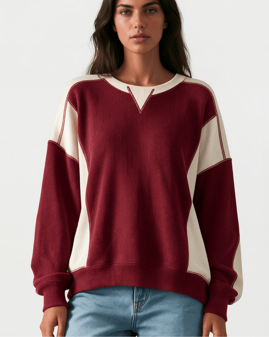Made in USA. Burgundy &amp; cream color block ribbed knit sweatshirt. Notched neck, exposed seams, oversized fit. 97% polyester. Sizes S–XL.