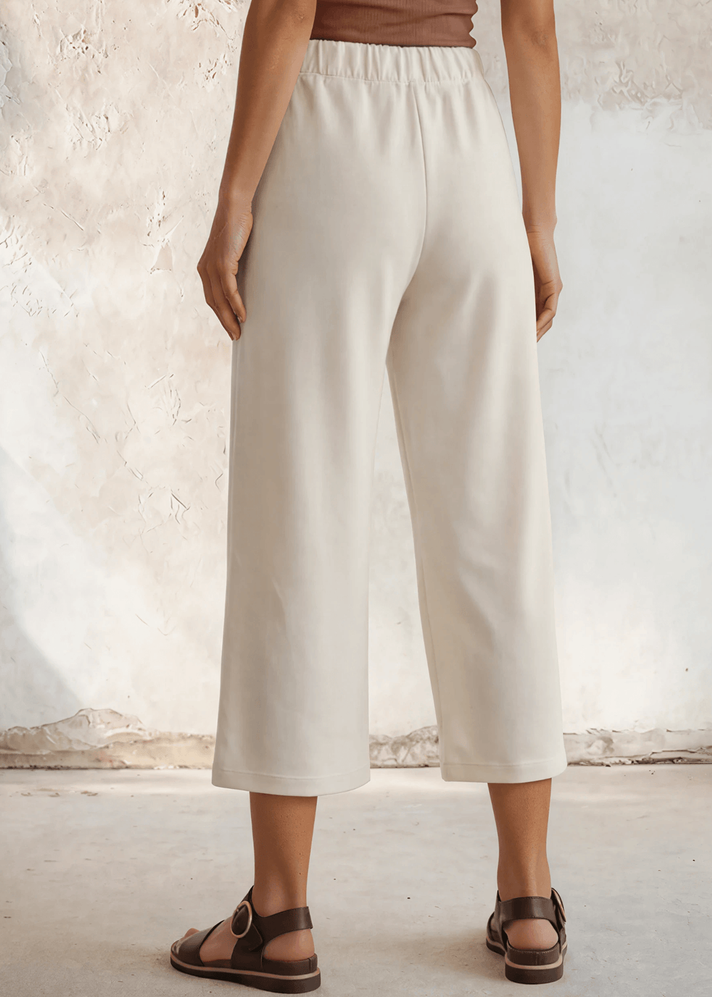 Shop the Cary Wide Leg Cropped Pant — soft modal-blend knit, elastic waist, side pockets, and a flattering relaxed fit. Made in USA.