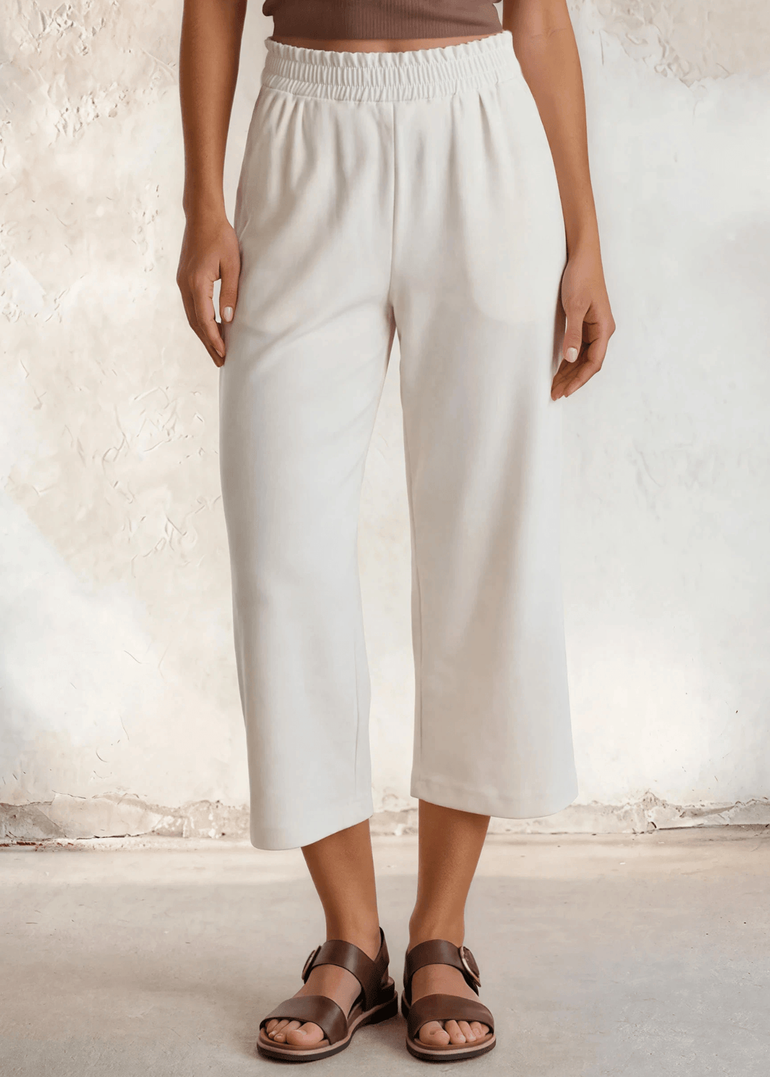 Shop the Cary Wide Leg Cropped Pant — soft modal-blend knit, elastic waist, side pockets, and a flattering relaxed fit. Made in USA.