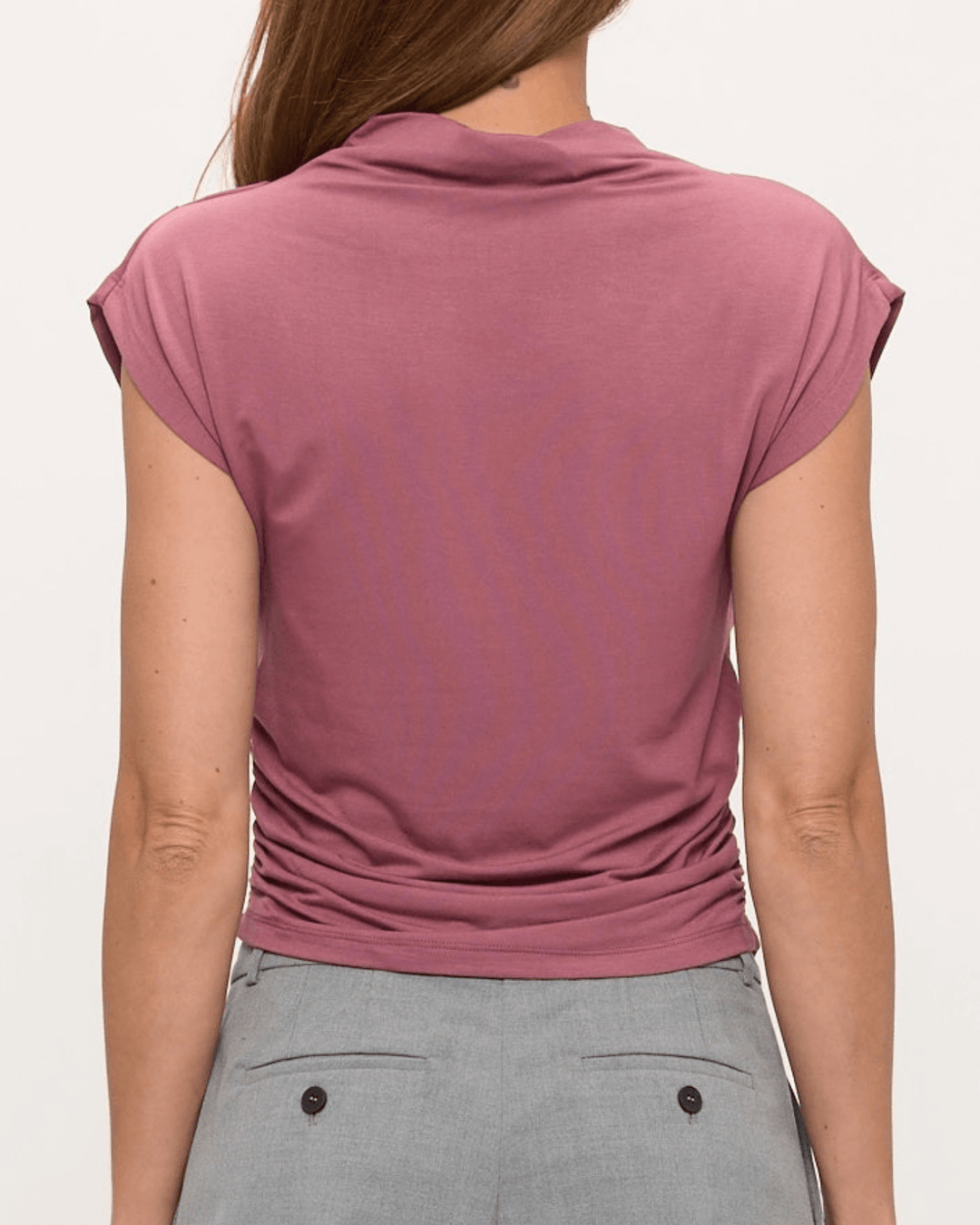 Woman wearing, made in USA, the Missy mock neck top pairs soft modal stretch with flattering side ruching. Shop this fitted short-sleeve style in Mauve.