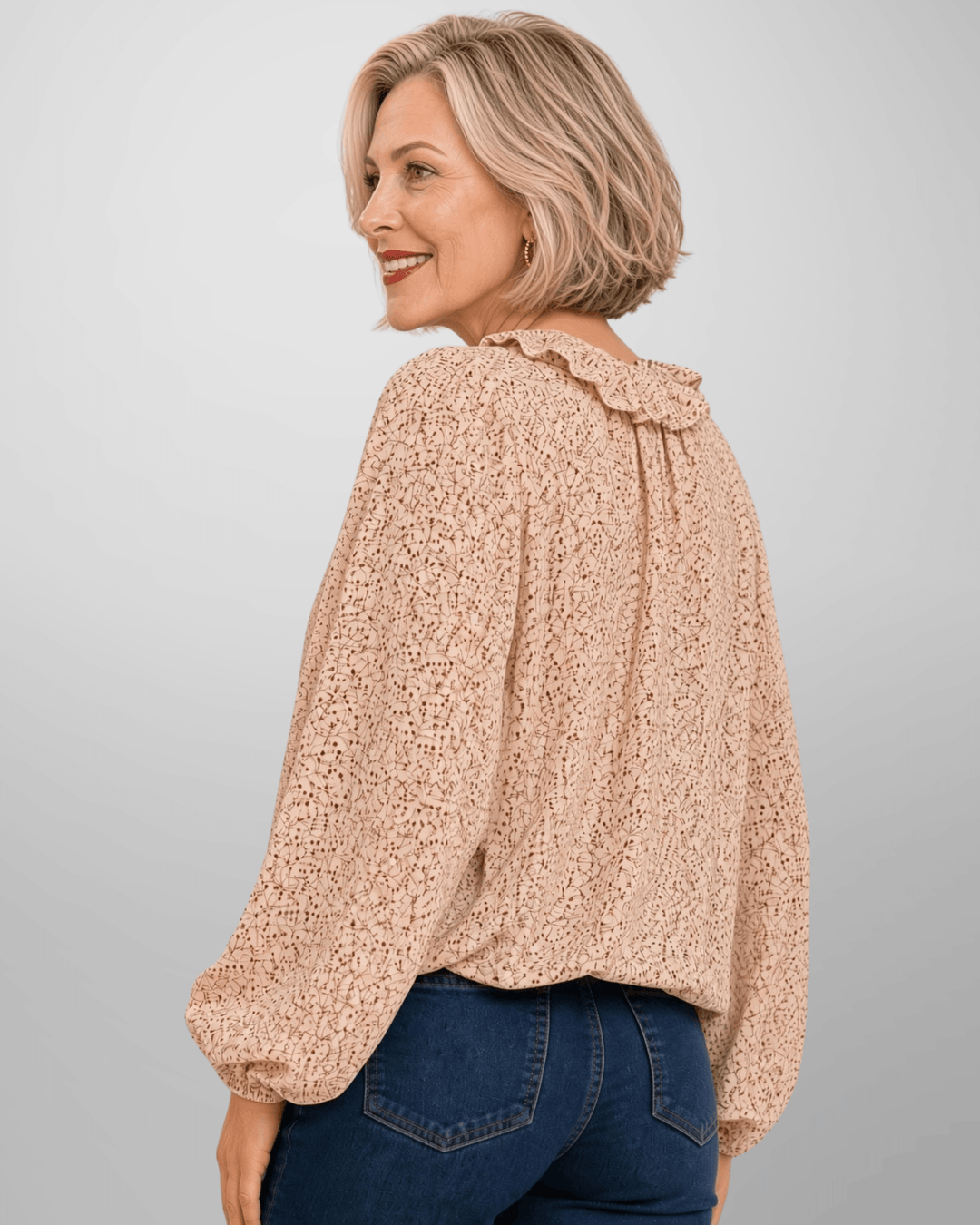 Made in USA. Renee cream botanical print blouse with a ruffled V-neck, balloon sleeves and bubble hem. Lightweight woven style for casual or dressy days.