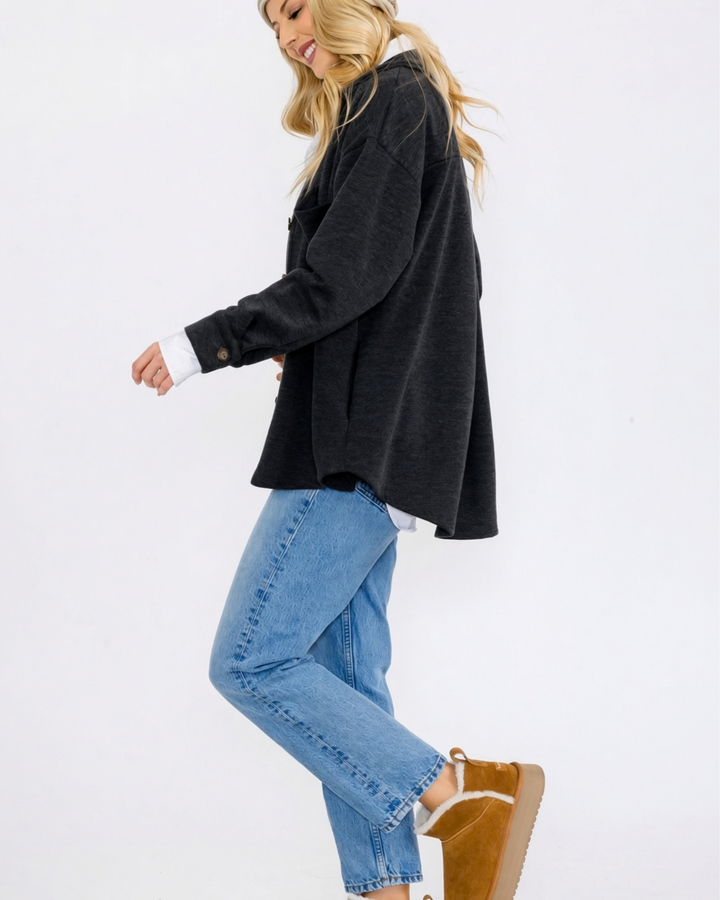 Made in USA button-down shacket with a relaxed fit, side pockets, and a medium-weight feel. Layer in Charcoal Black or Olive, sizes S–L