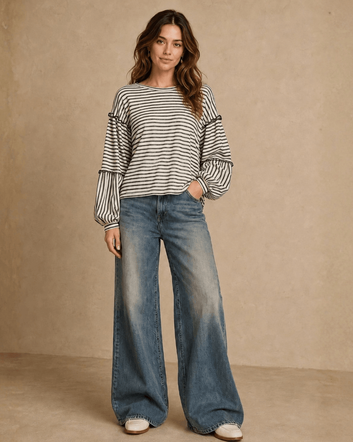 Made in USA. Tori textured striped top features stretch knit, tiered bubble sleeves and delicate ruffle trim. An easy everyday style in regular and plus sizes.