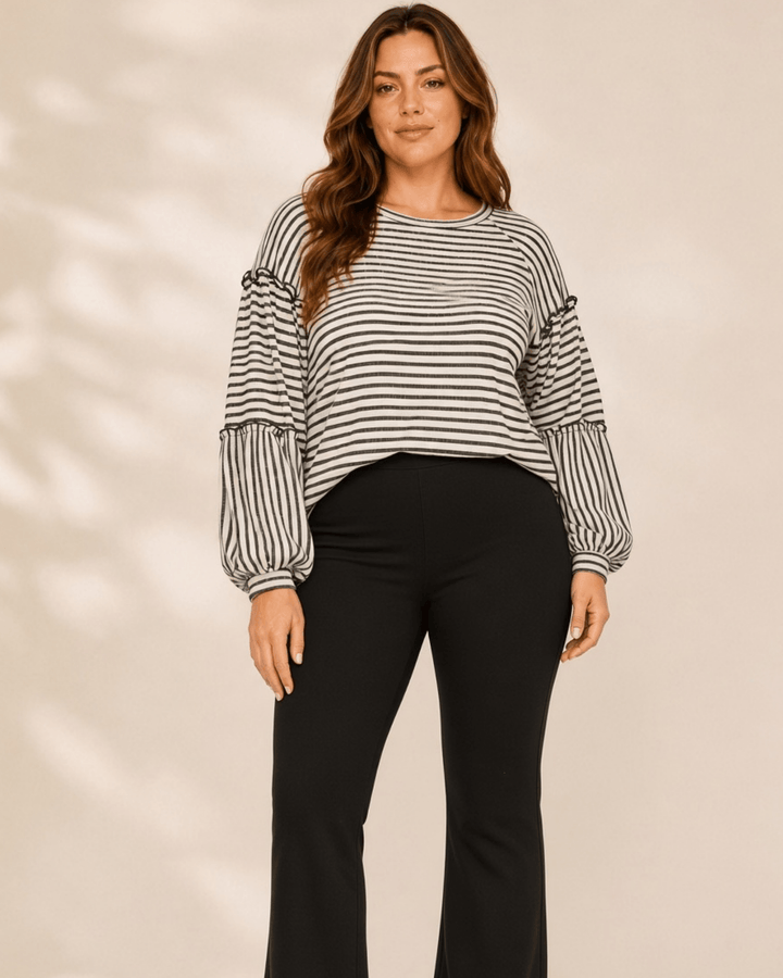 Made in USA. Tori textured striped top features stretch knit, tiered bubble sleeves and delicate ruffle trim. An easy everyday style in regular and plus sizes.