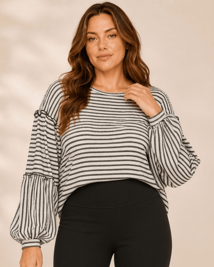 Made in USA. Tori textured striped top features stretch knit, tiered bubble sleeves and delicate ruffle trim. An easy everyday style in regular and plus sizes.