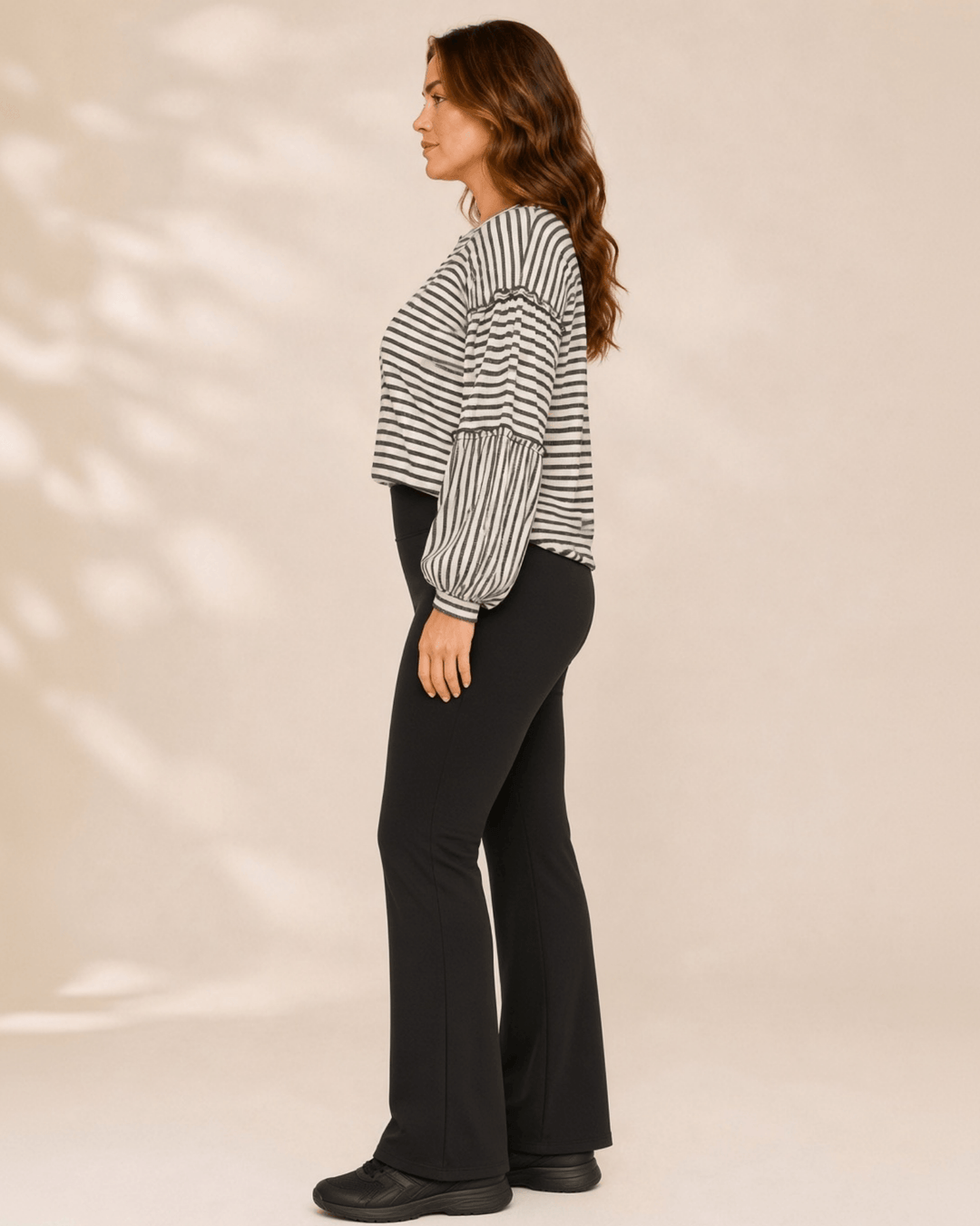 Made in USA. Tori textured striped top features stretch knit, tiered bubble sleeves and delicate ruffle trim. An easy everyday style in regular and plus sizes.