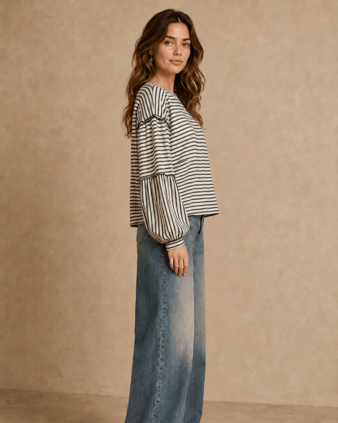 Made in USA. Tori textured striped top features stretch knit, tiered bubble sleeves and delicate ruffle trim. An easy everyday style in regular and plus sizes.