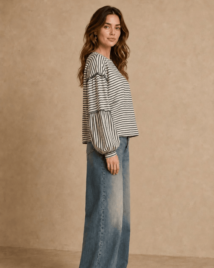 Made in USA. Tori textured striped top features stretch knit, tiered bubble sleeves and delicate ruffle trim. An easy everyday style in regular and plus sizes.
