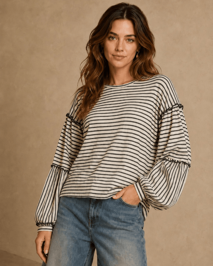 Made in USA. Tori textured striped top features stretch knit, tiered bubble sleeves and delicate ruffle trim. An easy everyday style in regular and plus sizes.