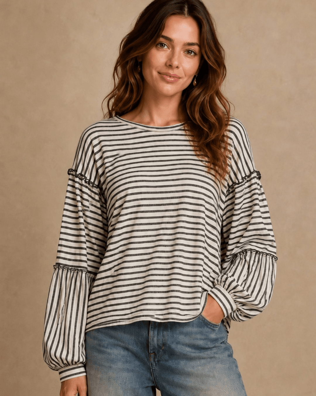 Made in USA. Tori textured striped top features stretch knit, tiered bubble sleeves and delicate ruffle trim. An easy everyday style in regular and plus sizes.