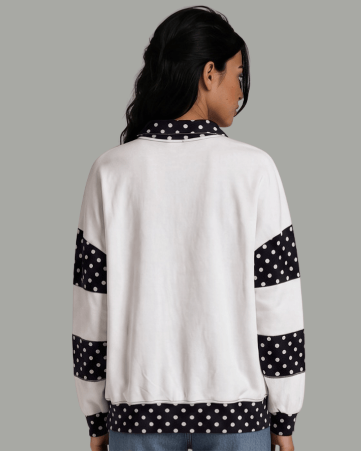 Made in USA White French terry pullover with black polka dot contrast collar, sleeves &amp; hem. Open V-neck, relaxed fit. 95% cotton. Made in USA. Sizes S–L