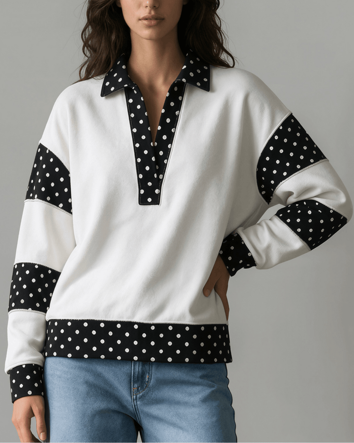 Made in USA White French terry pullover with black polka dot contrast collar, sleeves &amp; hem. Open V-neck, relaxed fit. 95% cotton. Made in USA. Sizes S–L