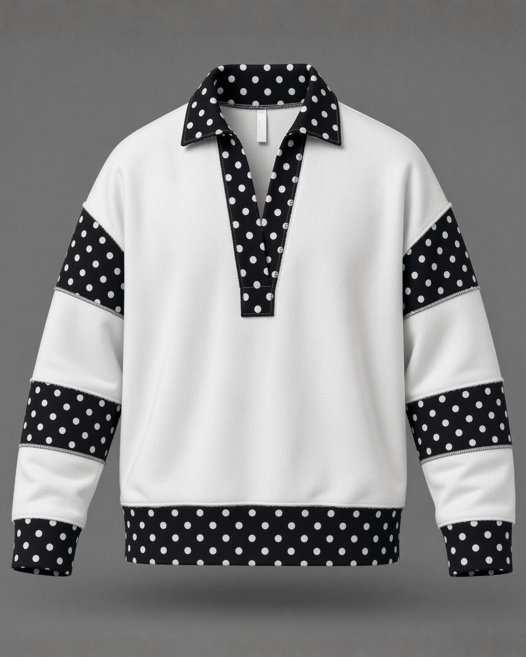 Made in USA White French terry pullover with black polka dot contrast collar, sleeves &amp; hem. Open V-neck, relaxed fit. 95% cotton. Made in USA. Sizes S–L