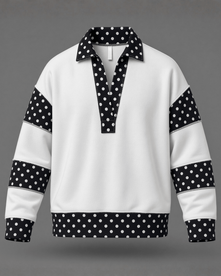 Made in USA White French terry pullover with black polka dot contrast collar, sleeves &amp; hem. Open V-neck, relaxed fit. 95% cotton. Made in USA. Sizes S–L