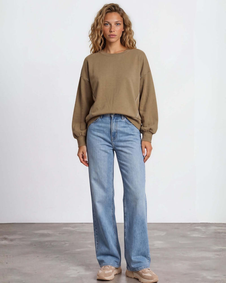 Made in USA cotton-wash pullover with an oversized boxy fit and two-tone raw-edge details. Shop the easygoing Wine or Mocha sweatshirt in S–XL.