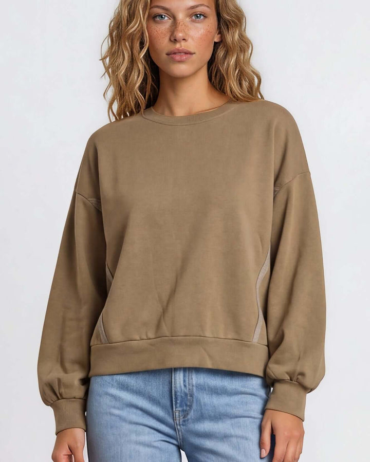 Made in USA cotton-wash pullover with an oversized boxy fit and two-tone raw-edge details. Shop the easygoing Wine or Mocha sweatshirt in S–XL.
