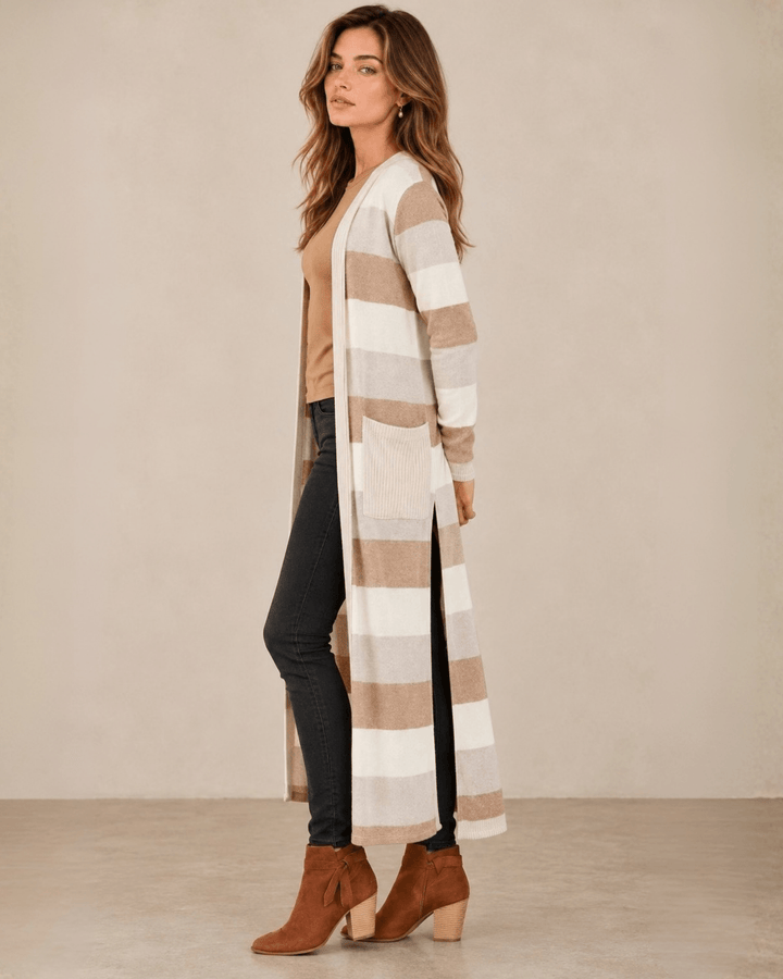 Woman wearing Made in USA the Lilian taupe striped longline cardigan with an open front, long sleeves, patch pockets and side slits for easy everyday layering.