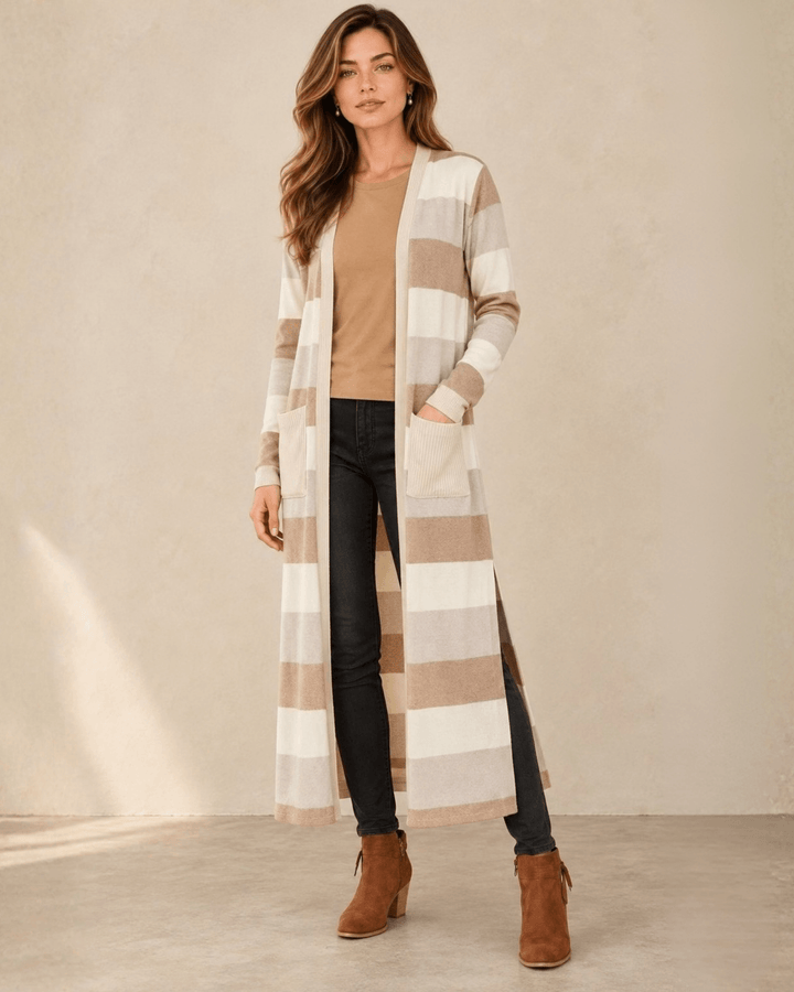 Woman wearing Made in USA the Lilian taupe striped longline cardigan with an open front, long sleeves, patch pockets and side slits for easy everyday layering.