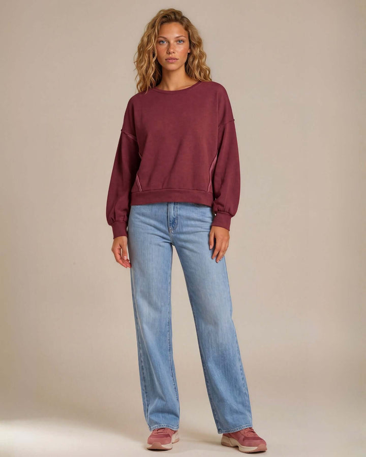 Made in USA cotton-wash pullover with an oversized boxy fit and two-tone raw-edge details. Shop the easygoing Wine or Mocha sweatshirt in S–XL.
