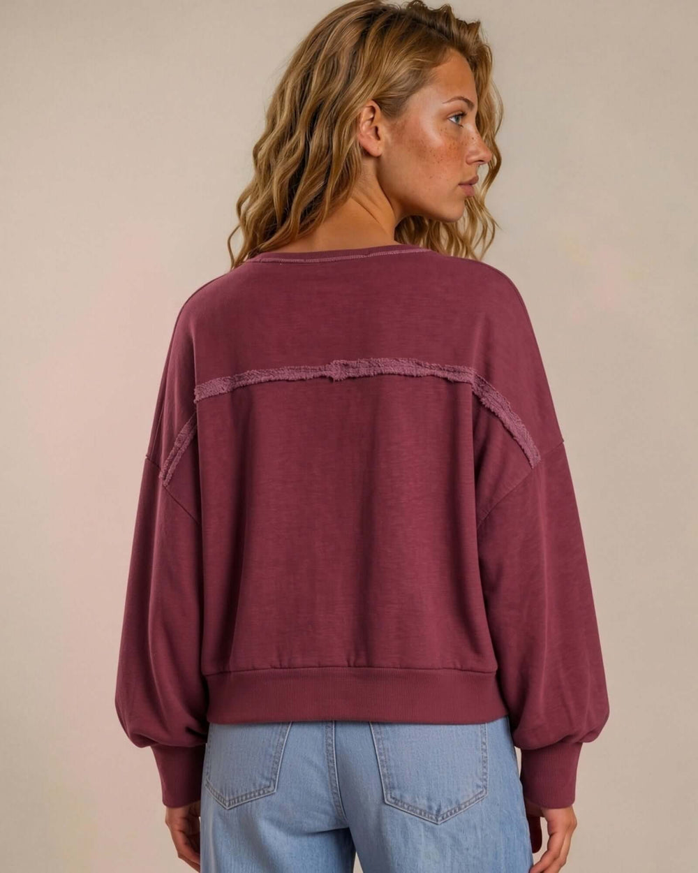 Made in USA cotton-wash pullover with an oversized boxy fit and two-tone raw-edge details. Shop the easygoing Wine or Mocha sweatshirt in S–XL.