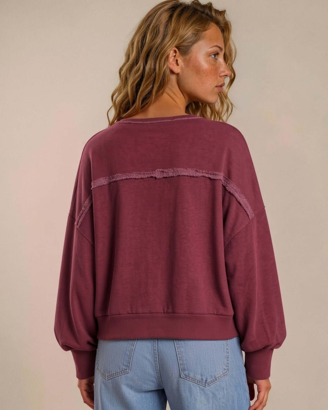 Made in USA cotton-wash pullover with an oversized boxy fit and two-tone raw-edge details. Shop the easygoing Wine or Mocha sweatshirt in S–XL.