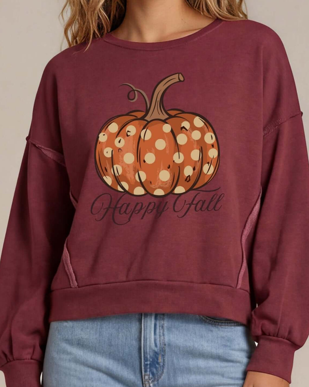 Made in USA pumpkin graphic pullover with playful “Happy Fall” lettering, raw-edge details, and an oversized boxy fit. Wine or Mocha, S–XL.