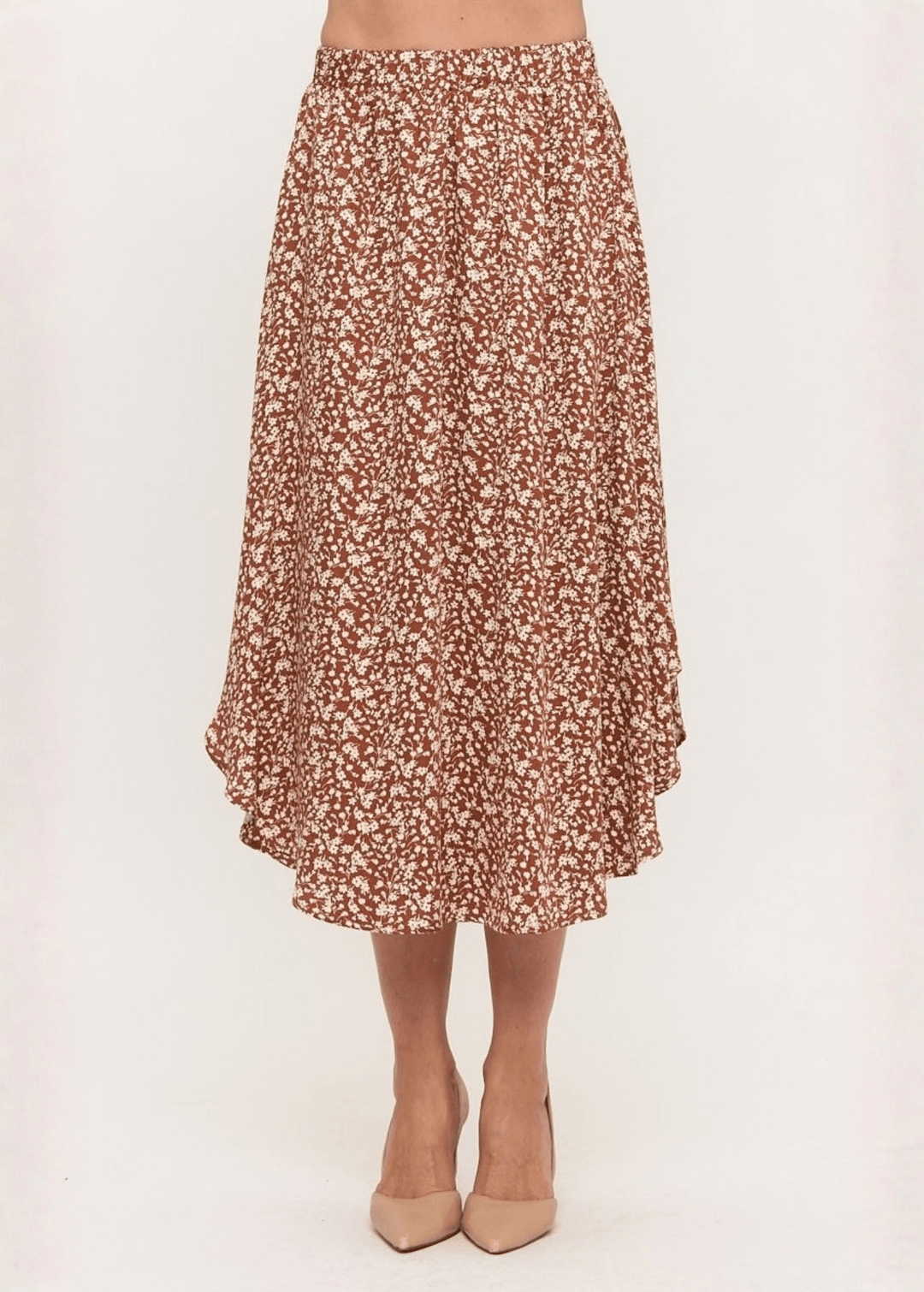 Made in USA. The Harvest rust floral midi skirt pairs a flowy handkerchief hem with a comfortable stretchy waistband. Soft rayon-Tencel blend in sizes S–L.
