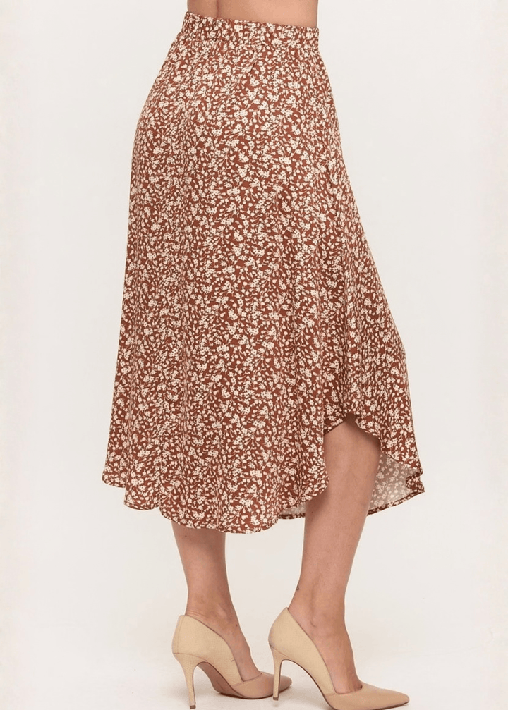Made in USA. The Harvest rust floral midi skirt pairs a flowy handkerchief hem with a comfortable stretchy waistband. Soft rayon-Tencel blend in sizes S–L.