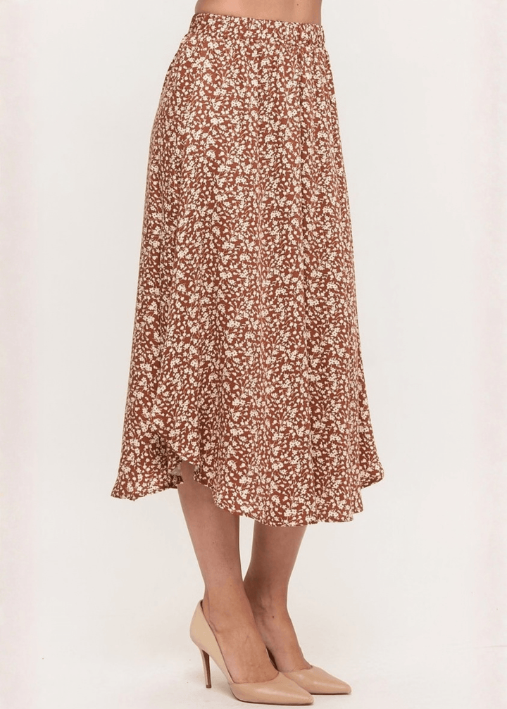Made in USA. The Harvest rust floral midi skirt pairs a flowy handkerchief hem with a comfortable stretchy waistband. Soft rayon-Tencel blend in sizes S–L.