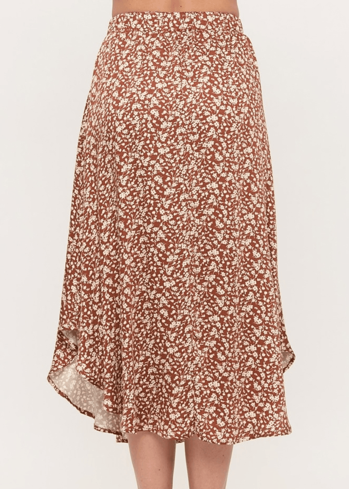 Made in USA. The Harvest rust floral midi skirt pairs a flowy handkerchief hem with a comfortable stretchy waistband. Soft rayon-Tencel blend in sizes S–L.