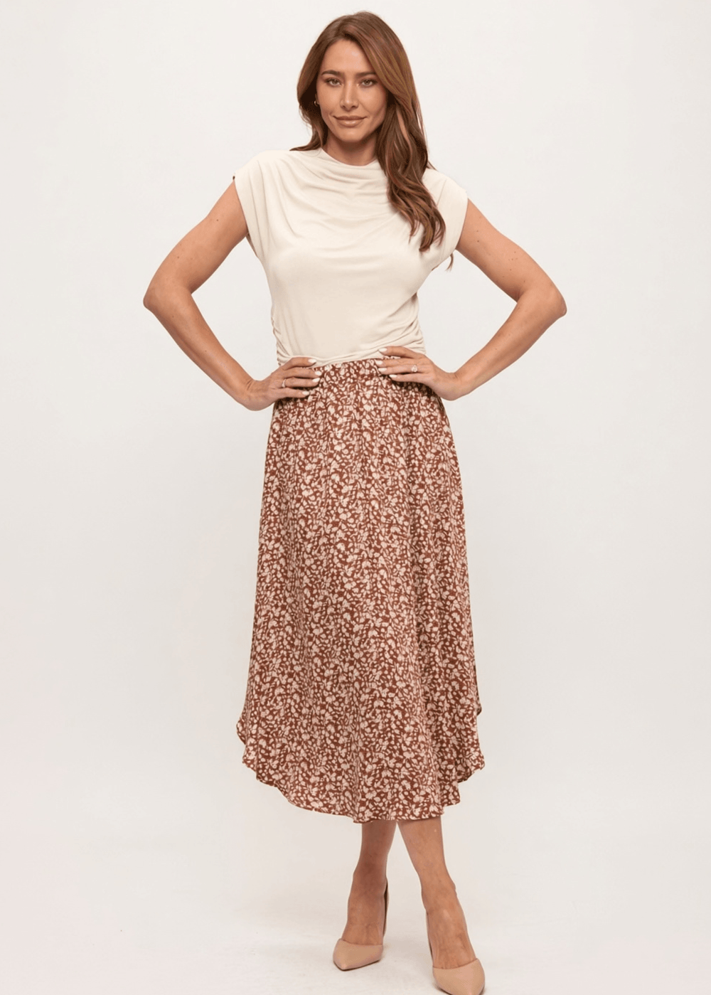 Made in USA. The Harvest rust floral midi skirt pairs a flowy handkerchief hem with a comfortable stretchy waistband. Soft rayon-Tencel blend in sizes S–L.