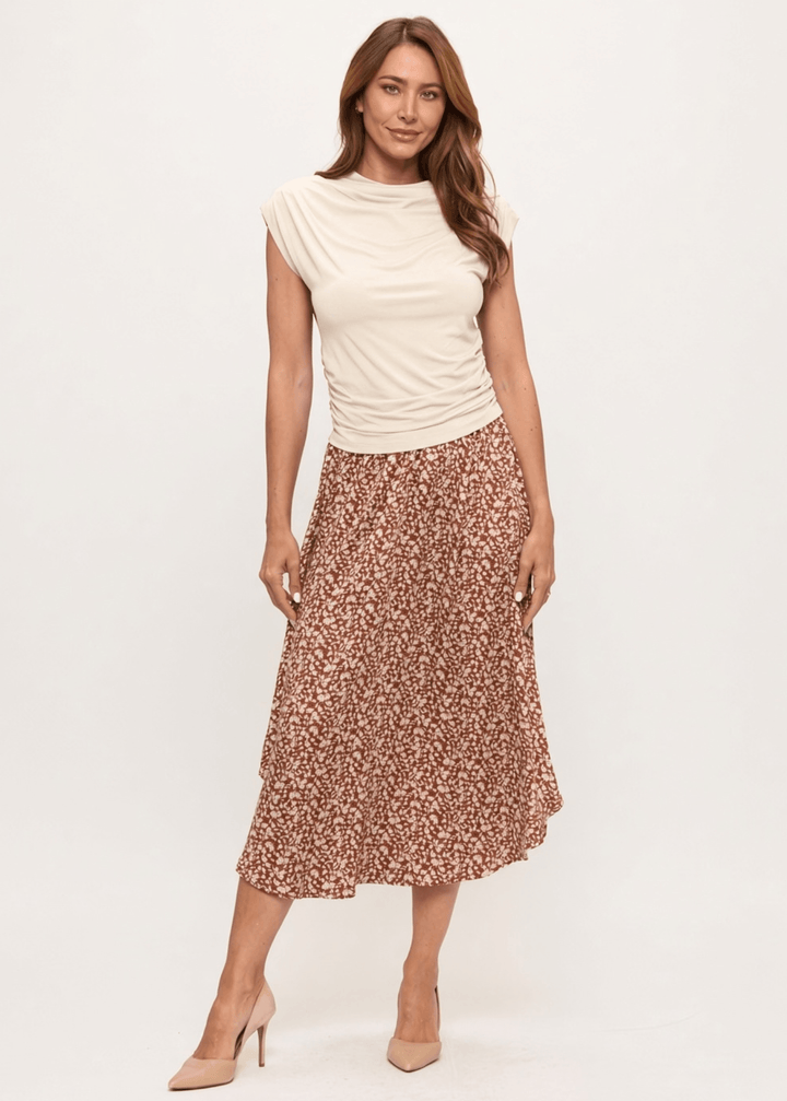 Made in USA. The Harvest rust floral midi skirt pairs a flowy handkerchief hem with a comfortable stretchy waistband. Soft rayon-Tencel blend in sizes S–L.