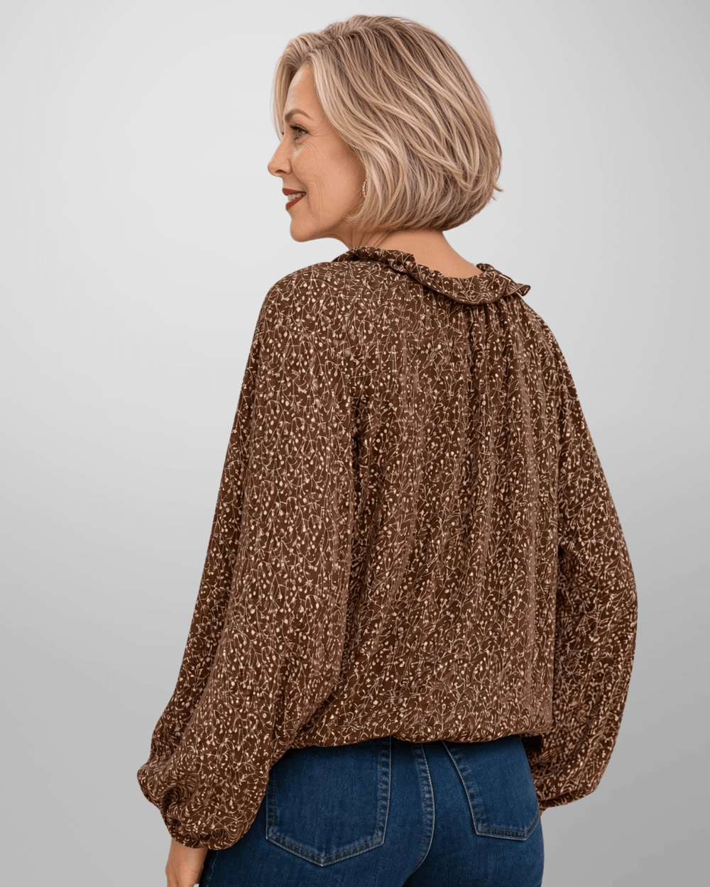Made in USA. Renee brown botanical print blouse with a ruffled V-neck, balloon sleeves and bubble hem. Lightweight woven style for casual or dressy days.