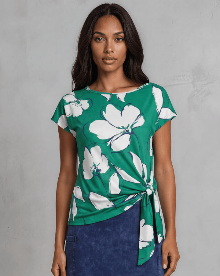 Shop the Farrah Floral Knot Top in bold green &amp; white. Semi-fitted, side knot detail, cap sleeves, sizes S-L. 95% Poly/5% Spandex. Made in USA.