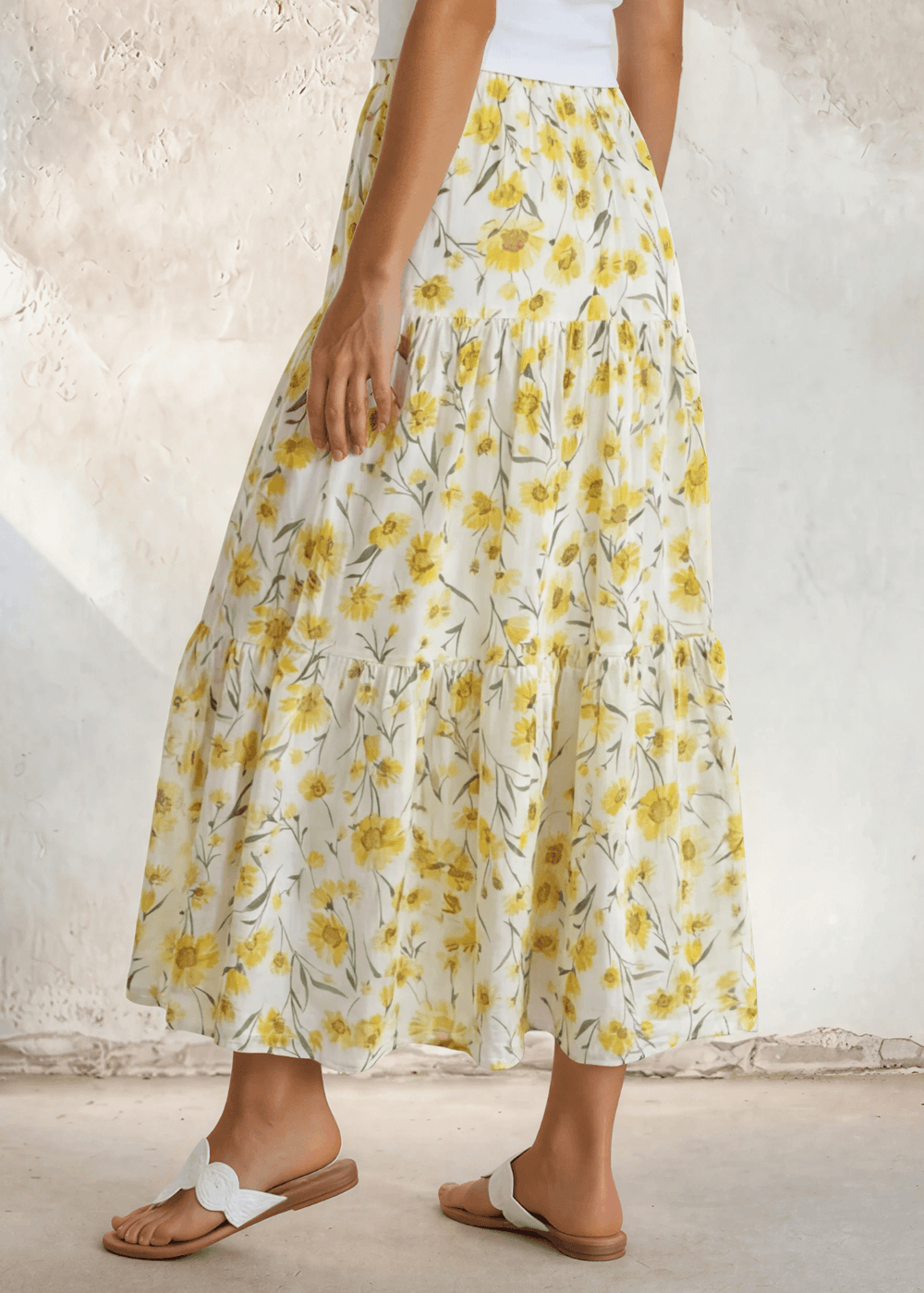 Sunshine meets style — the Sara Sunflower Bloom Maxi Skirt features a yellow floral print, three flowy tiers, and an elastic waist. Made in USA.