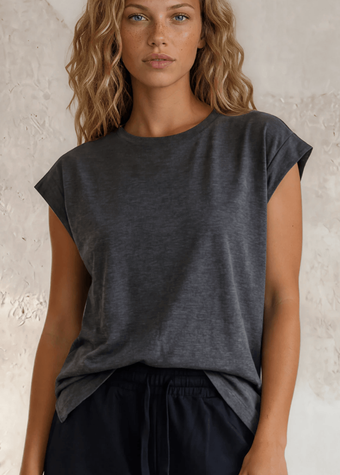The Marla Muscle Tee in Charcoal — soft cotton-rayon blend, relaxed fit, round neck, cropped sleeves. Your everyday essential. Made in USA.