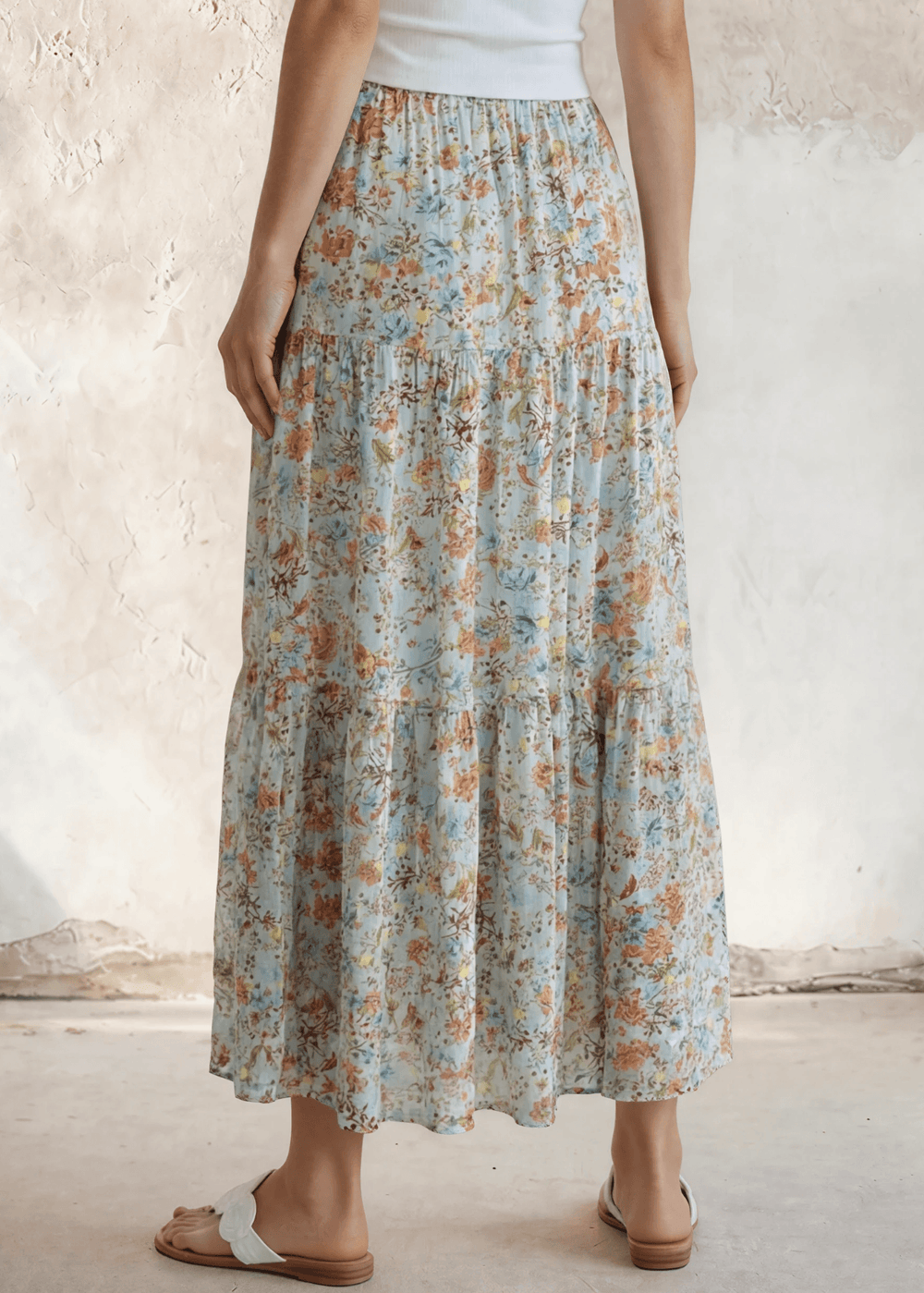 Stunning three-tiered floral pleated maxi skirt in sky blue — 100% rayon, elastic waist, flowy fit. Perfect for spring & summer events. Made in USA.