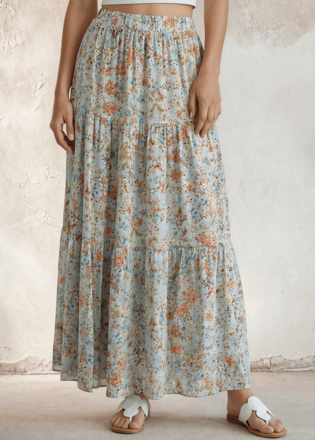Stunning three-tiered floral pleated maxi skirt in sky blue — 100% rayon, elastic waist, flowy fit. Perfect for spring & summer events. Made in USA.