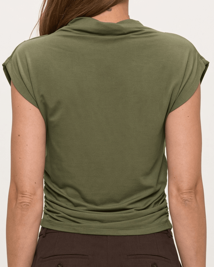 Woman wearing, made in USA, the Missy mock neck top pairs soft modal stretch with flattering side ruching. Shop this fitted short-sleeve style in Olive.