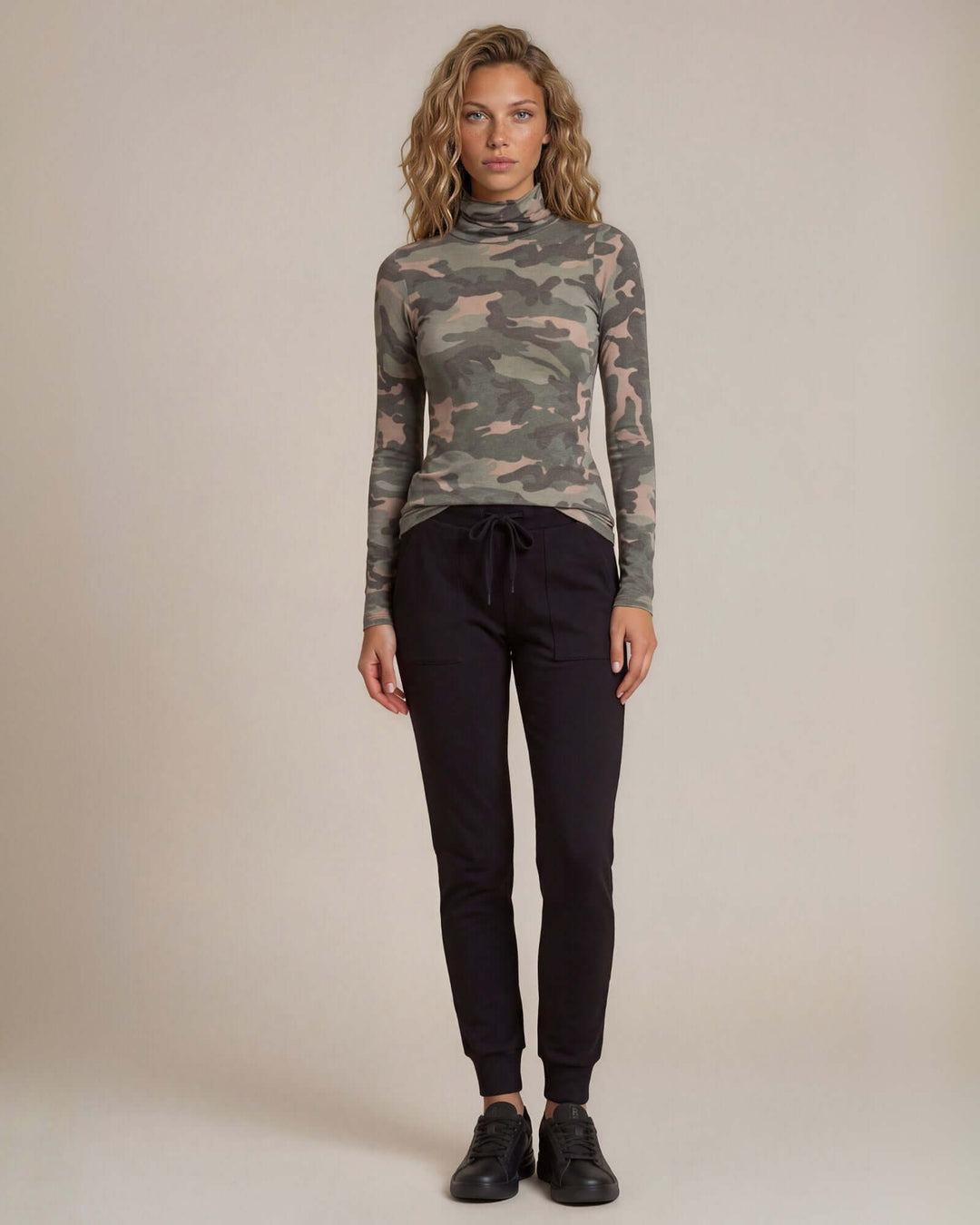 Made in USA Chloe Camo Turtleneck: full-length front view styled with black joggers and sneakers