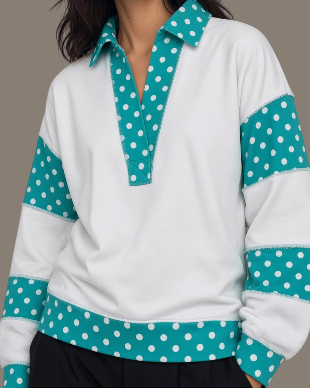 Made in USA. White French terry pullover with teal polka dot contrast collar, sleeves & hem. Open V-neck, relaxed fit. 95% cotton. Sizes S–L.