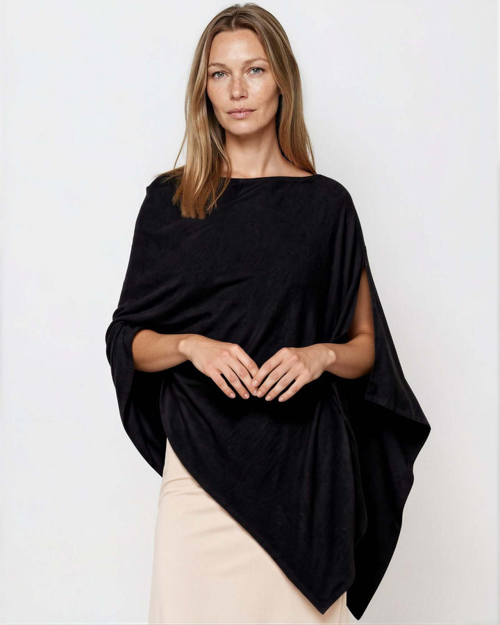 Made in USA Asymmetrical Boat Neck Poncho Top - Black: front view on model with nude pencil skirt