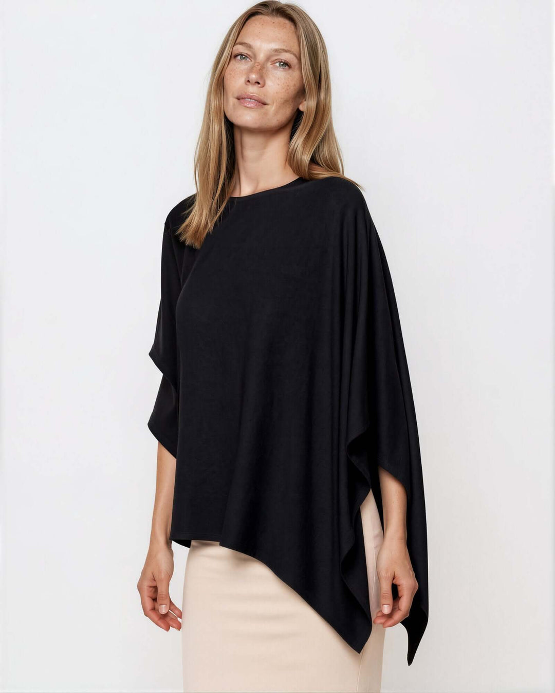 Made in USA Asymmetrical Boat Neck Poncho Top - Black: three-quarter front view of boat neck and pointed hem