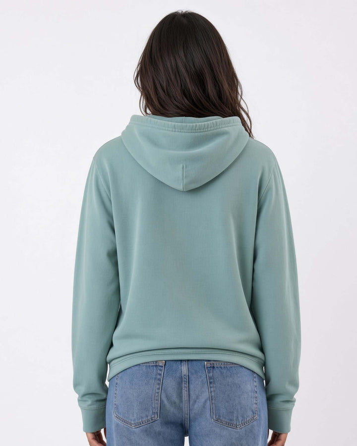 Made in USA The Boyfriend Cotton Washed Hoodie - Fern: back view of soft sage green hoodie on female model with jeans