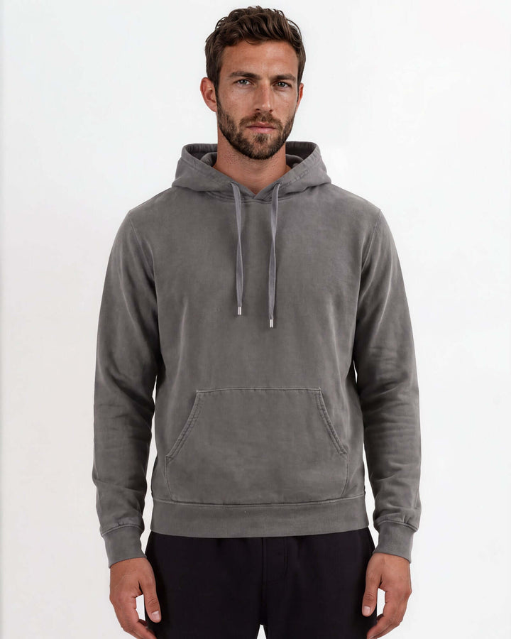 Made in USA vintage pigment dyed fleece pullover hoodie in Charcoal with drawstring hood, front pouch pocket, and ribbed cuffs and hem - front view