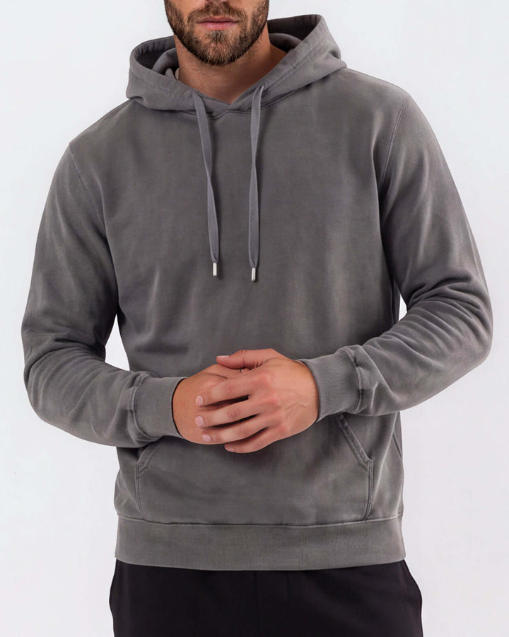 Made in USA vintage pigment dyed fleece pullover hoodie in Charcoal with drawstring hood, front pouch pocket, and ribbed cuffs and hem