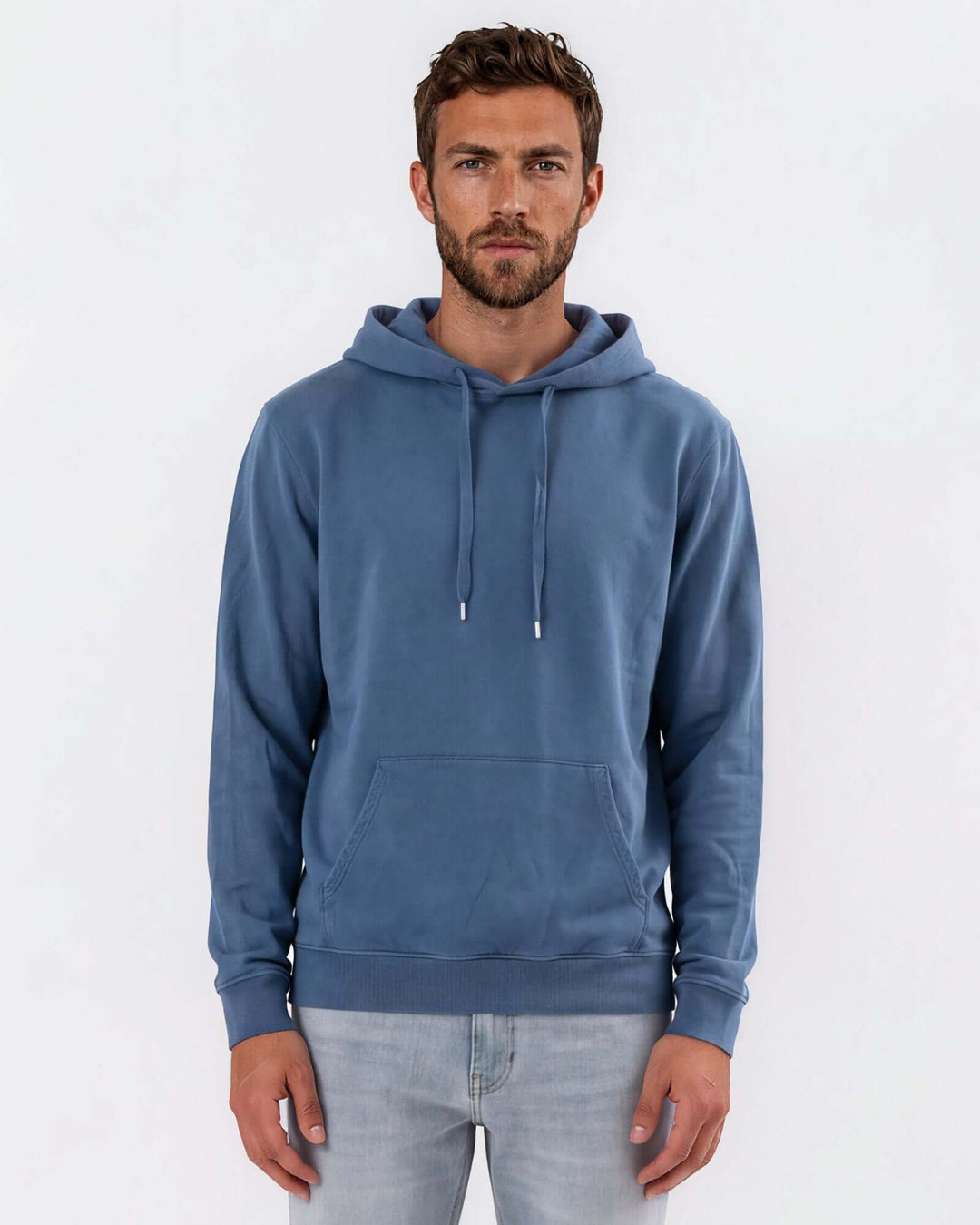Made in USA vintage pigment dyed fleece pullover hoodie in Blue Steel with drawstring hood, front pouch pocket, and ribbed cuffs and hem